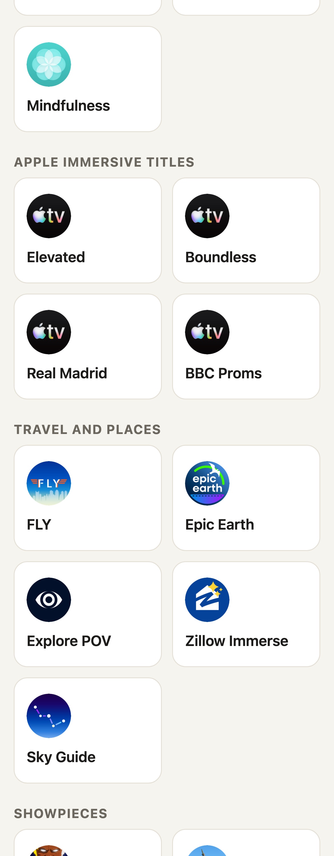 The Vision Test Drive remote on a phone: a Headset ready badge, then a Start here section with Photos, Spatial Gallery, TV (Apple Immersive), Encounter Dinosaurs and Mindfulness tiles, then Apple Immersive titles: Elevated, Boundless, Real Madrid and BBC Proms.